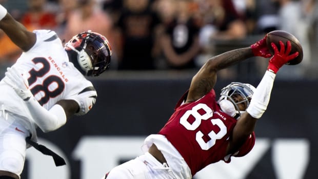 Arizona Cardinals wide receiver Greg Dortch (83) makes a catch as Cincinnati Bengals cornerback Bookie Radley-Hiles (38) defends in the first half at Paycor Stadium. Mandatory Credit: Albert Cesare-USA TODAY Sports